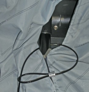 Wrap cable around the suitcase rib and pass the small end through the larger one.